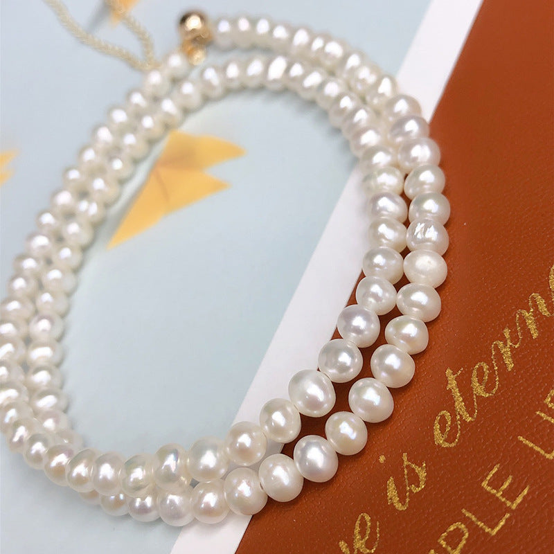 Natural freshwater pearl gray and white nearly round baby millet pearl clavicle necklace